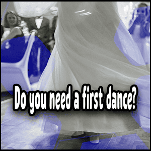 A bride in a white dress is dancing.